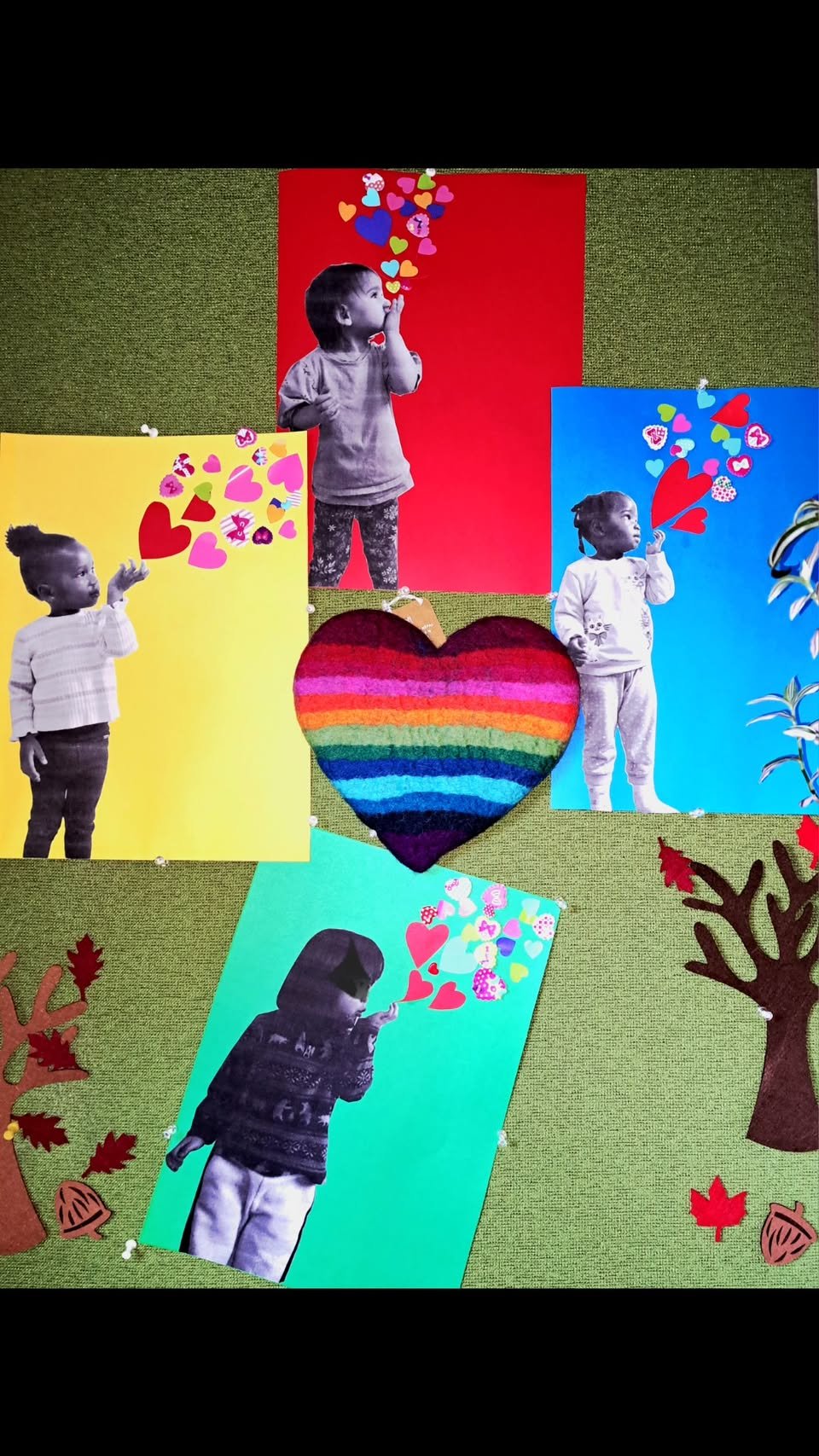 Colorful children's artwork displayed on a board