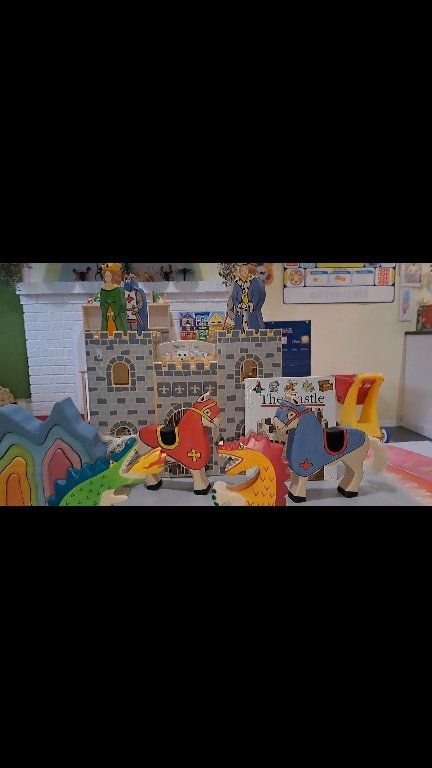 Toy castle and wooden dragons