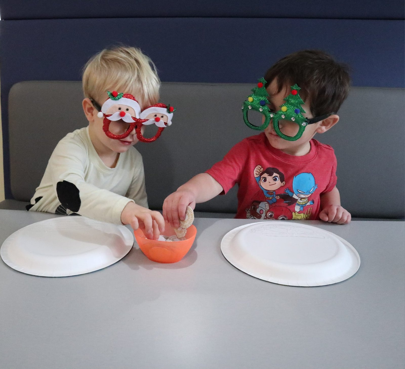 Boys doing a craft with paper plates