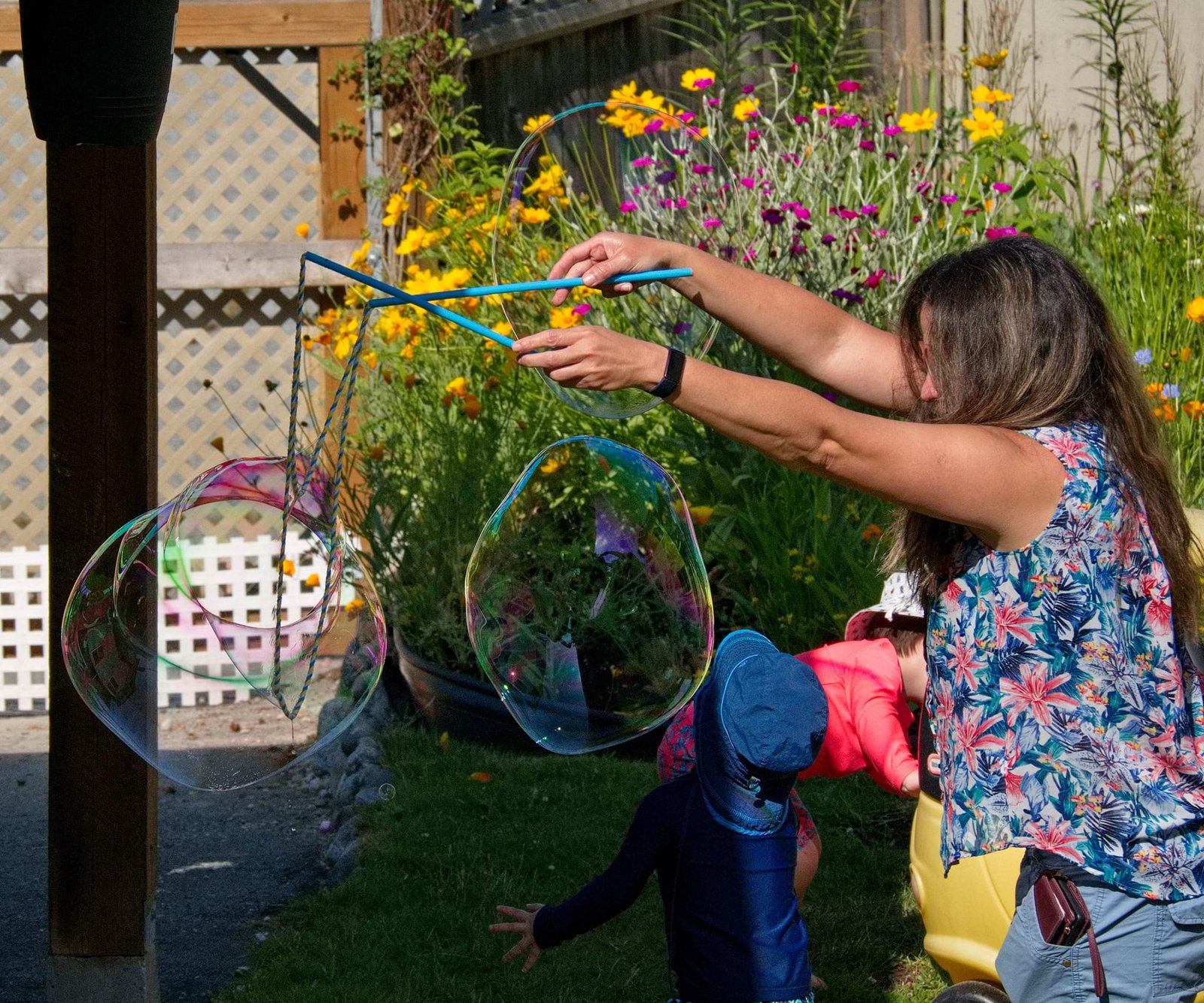 Teacher making huge bubbles for the kids