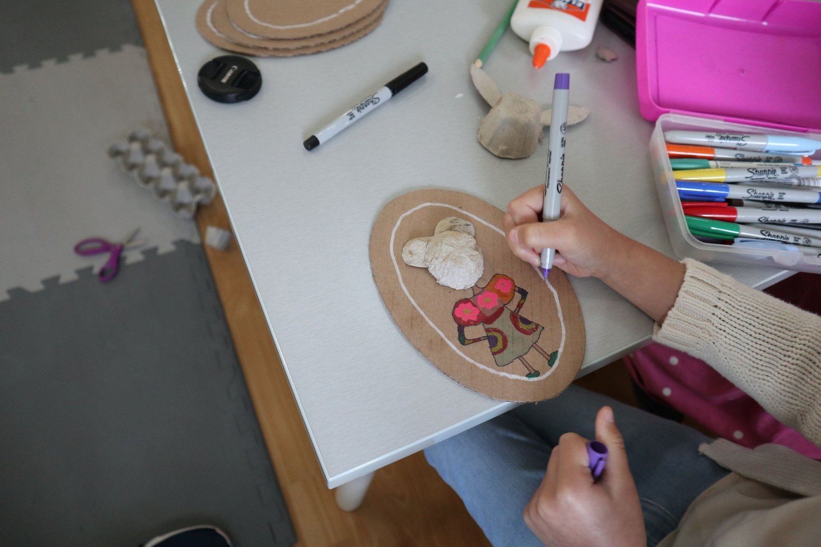 Child drawing and doing an art project
